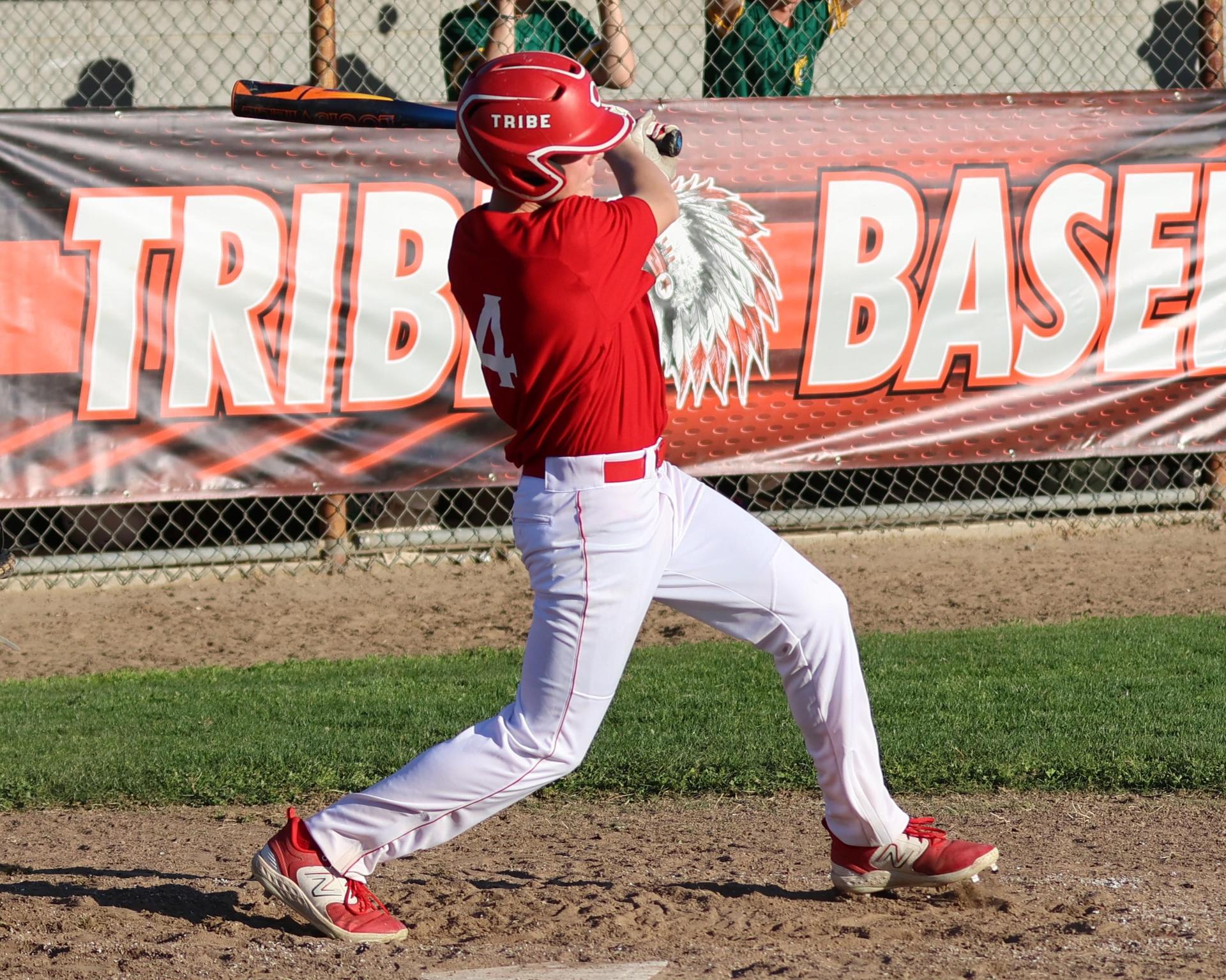 junior varsity baseball players in action