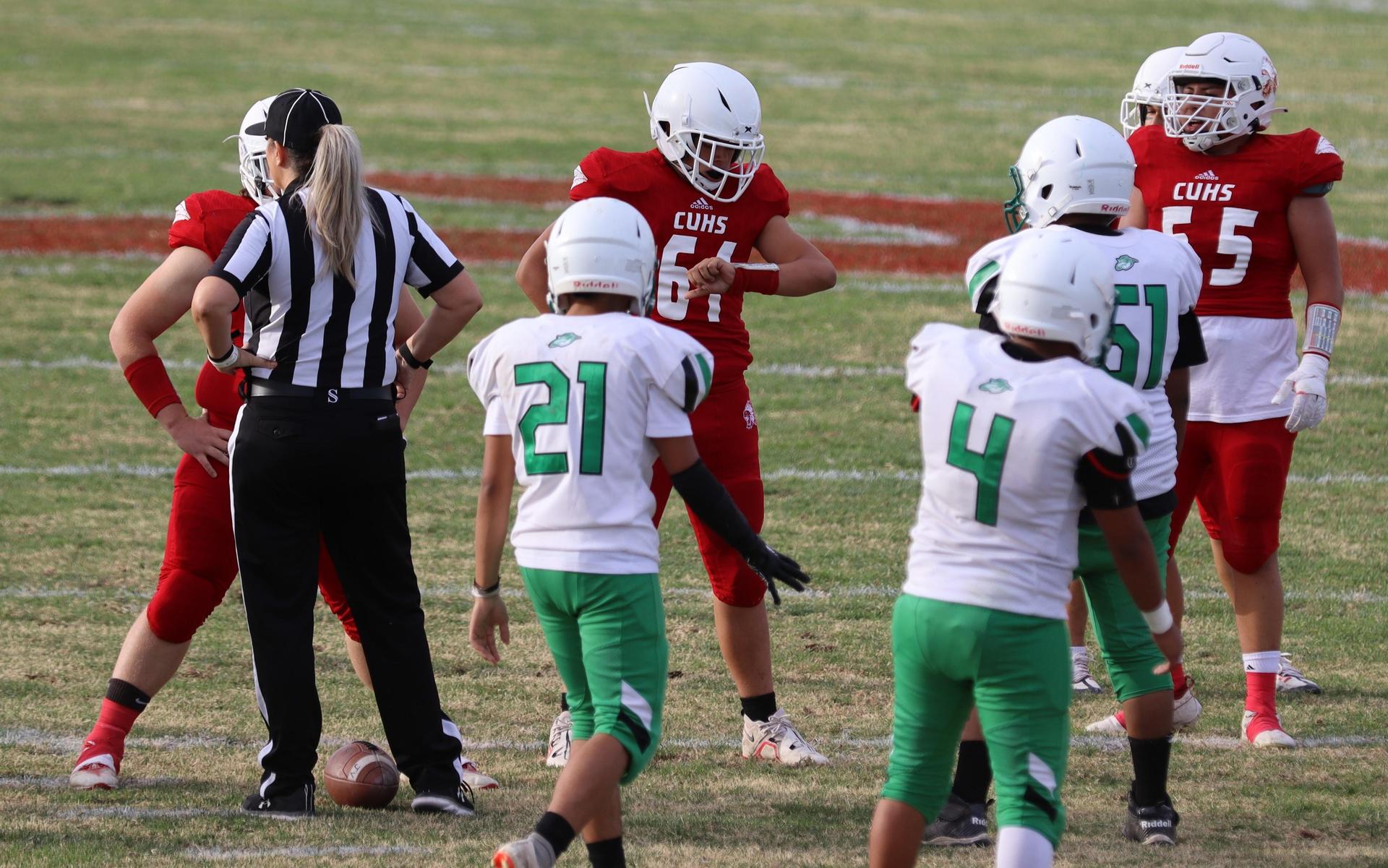  junior varsity football players in action against riverdale