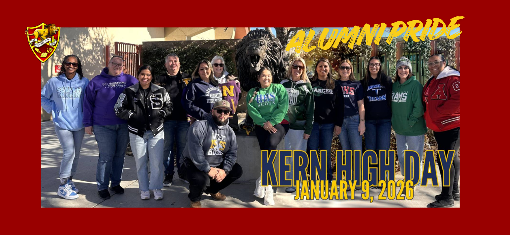 A group of alumni poses outdoors wearing school sweatshirts, celebrating Kern High Day.