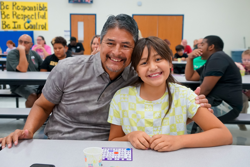 Grandfather and student at Legacy Elementary Bingo Event