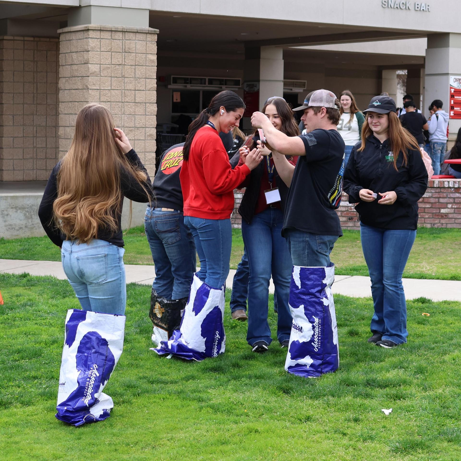 students and staff enjoying the feed bag relay