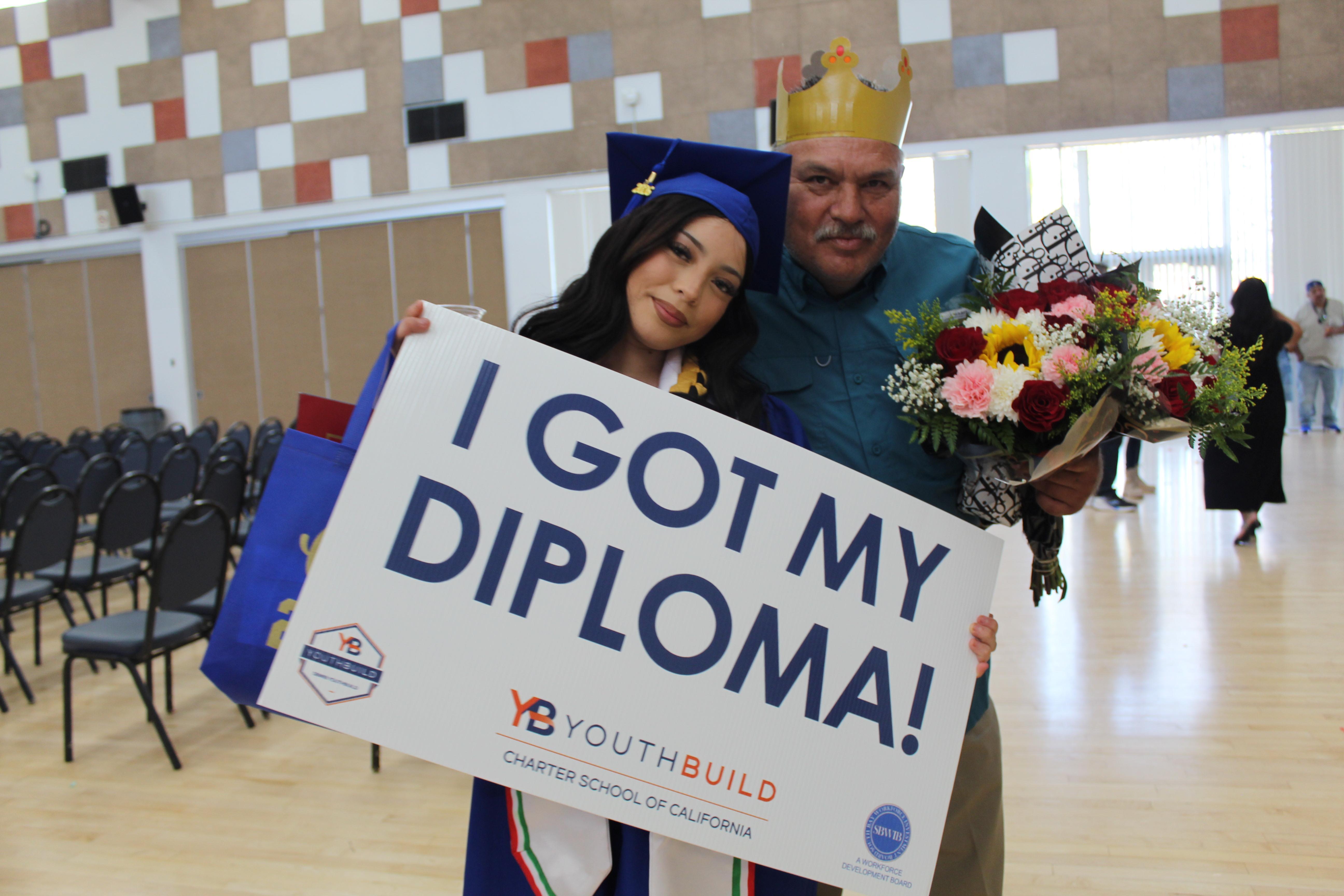 A graduate poses with her family