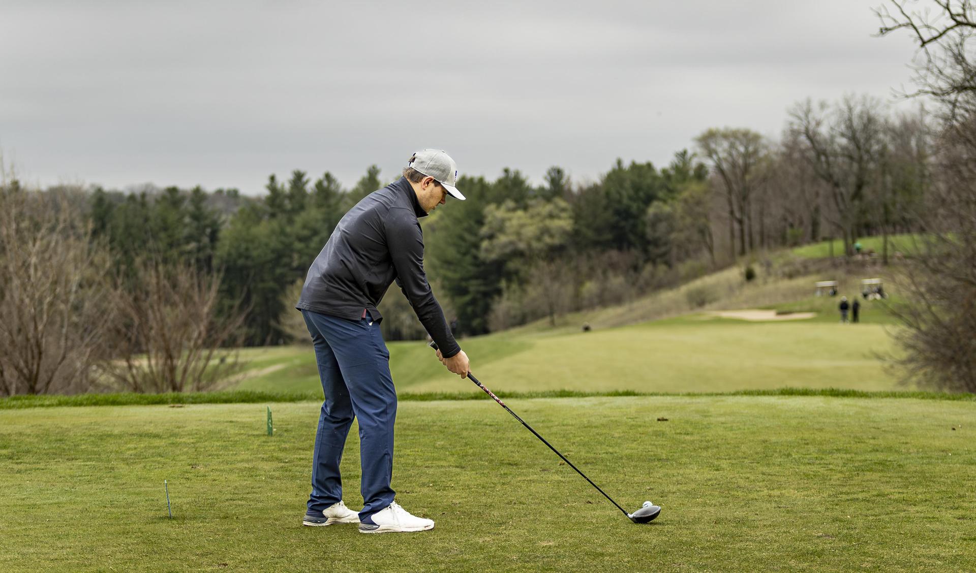 Preparing to hit the golf ball