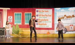 Two students hold a rope as if they are going to have a tug-o-war.