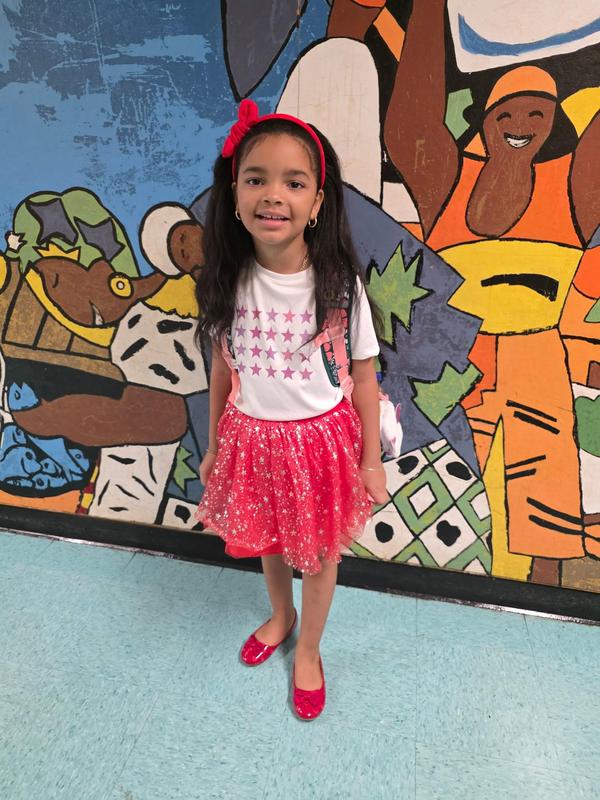 Student in t-shirt with stars and pink tutu