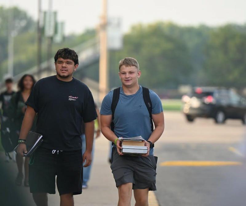 student carrying text books