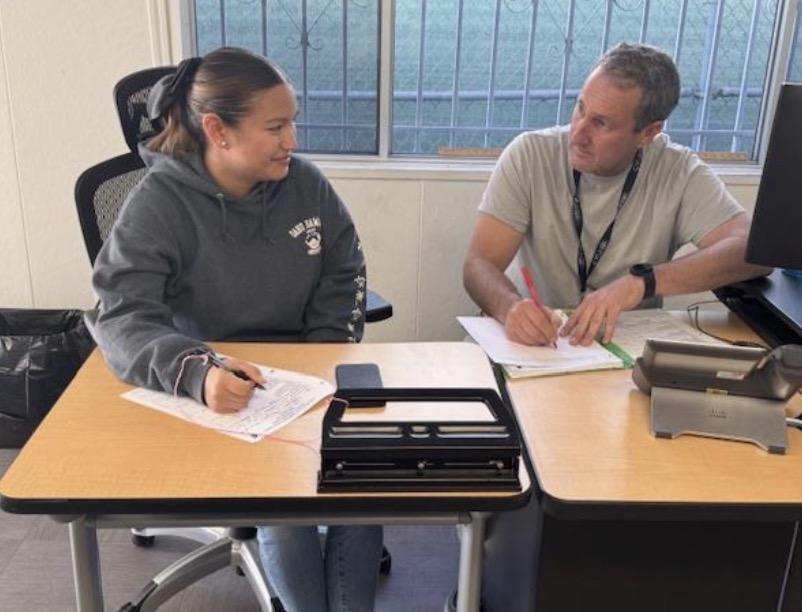 Teacher working with student