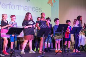 Lower schooler Preforming on Flutes During Talent Show
