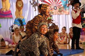Students dressed as leopards in a pyramid formation