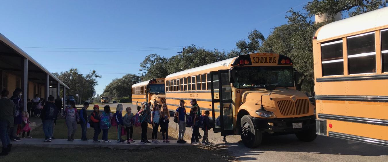Kids loading on school bus