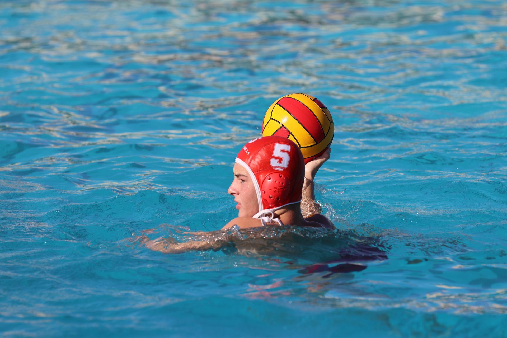 boys playing water polo against Madera
