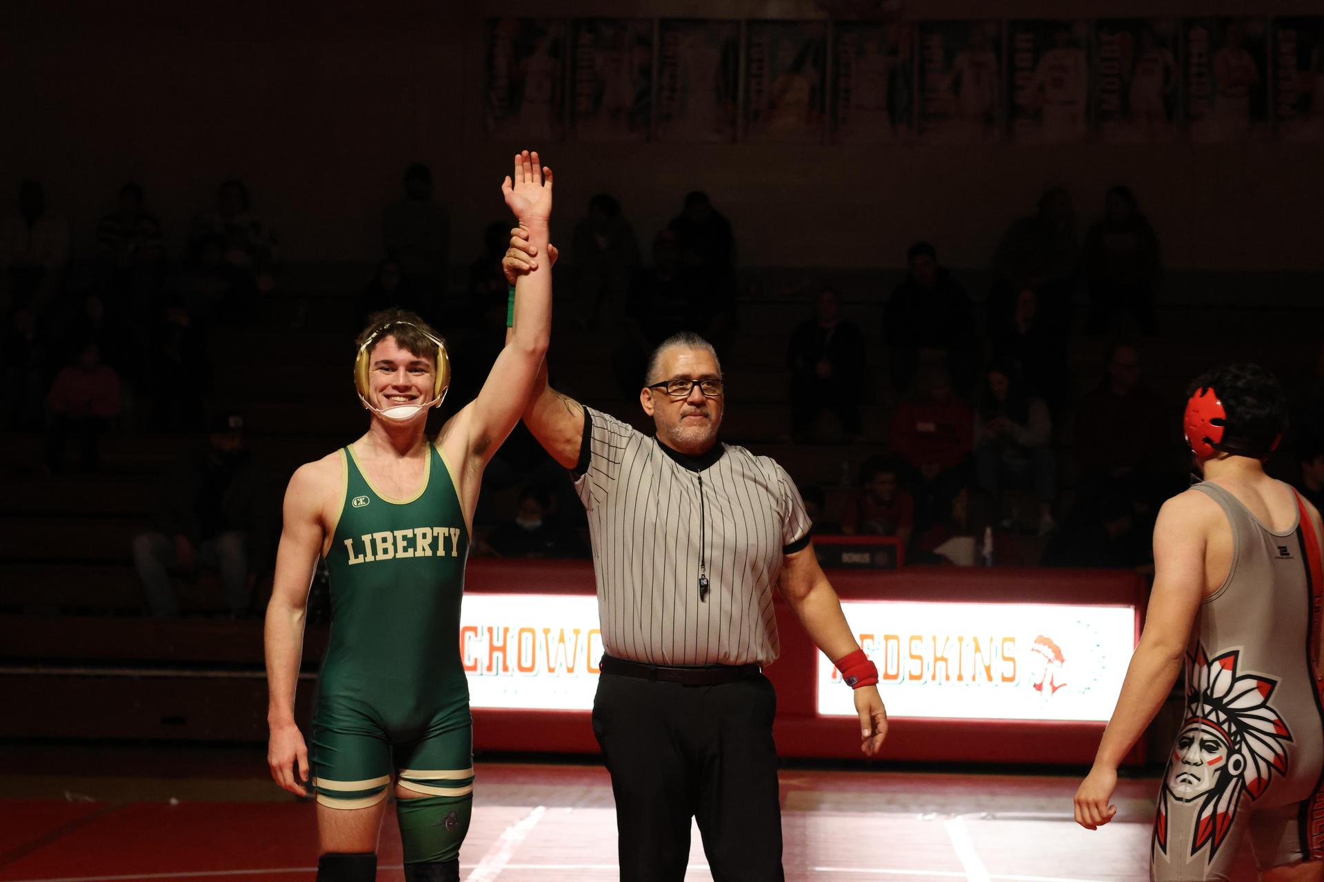 Wrestling winners with hands up 128