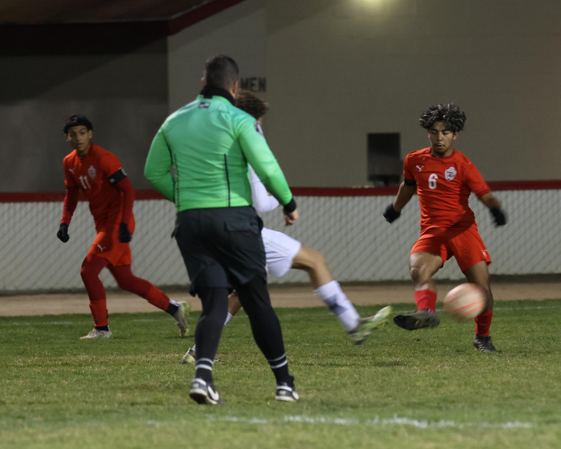 varisty boys soccer playing against yosemite