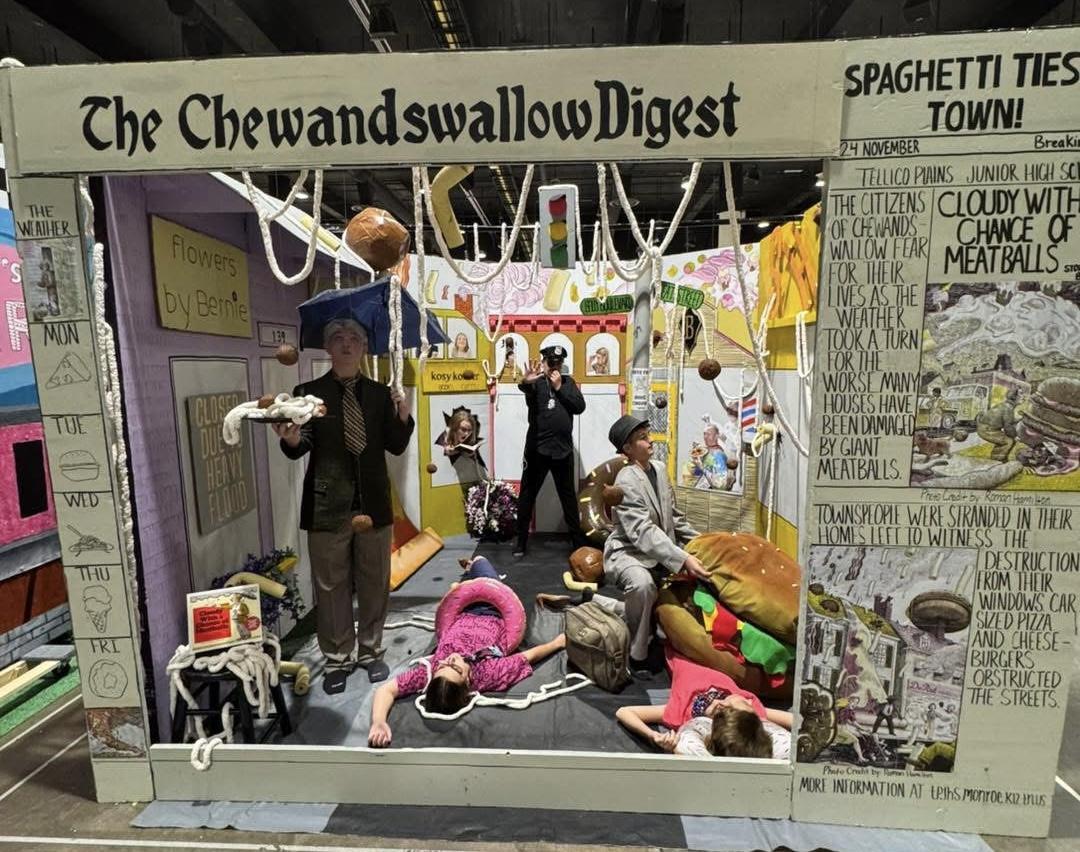 Scene of students frozen in place. Scene is from the book, "Cloudy with a Chance of Meatballs.". 