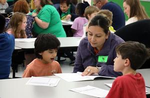 Buchanan Elementary students share writing with adults.