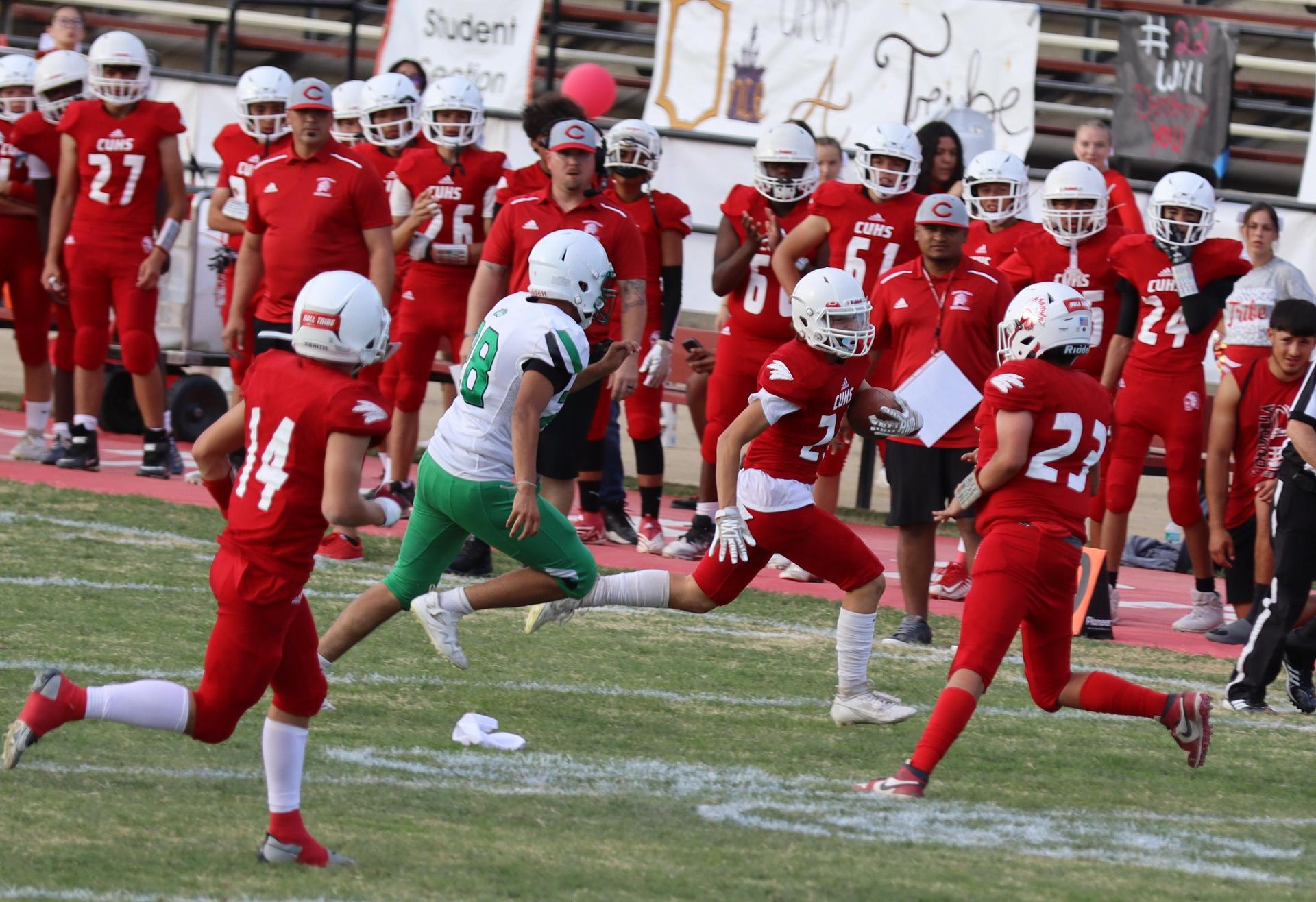  junior varsity football players in action against riverdale