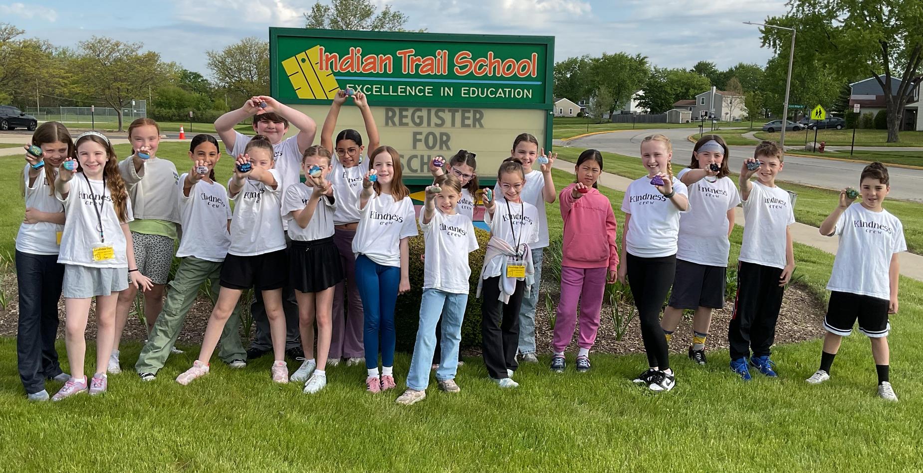 Indian Trail School Kindness Crew group photo in front of school sign