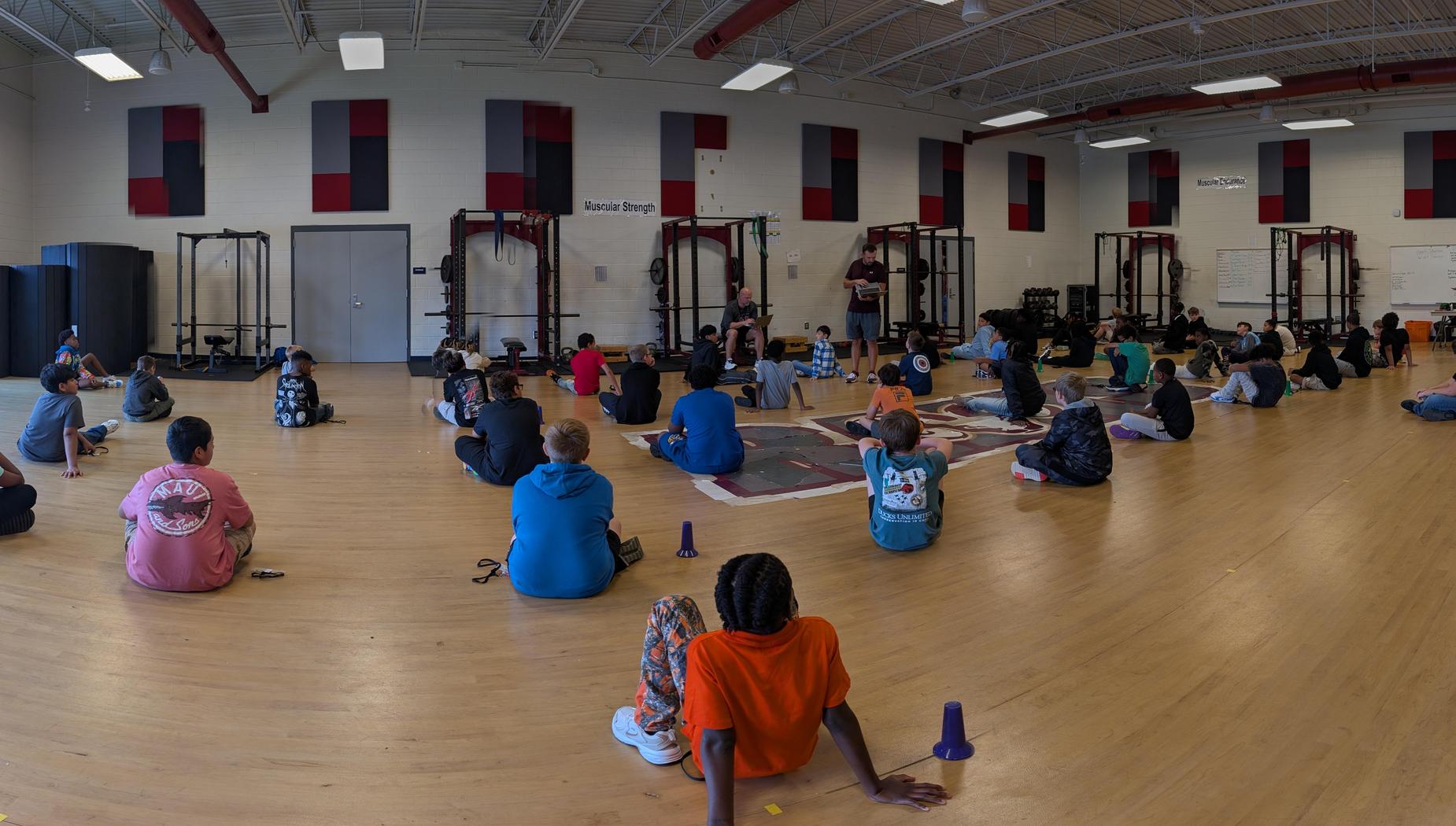 boys sitting in the multi-purpose room