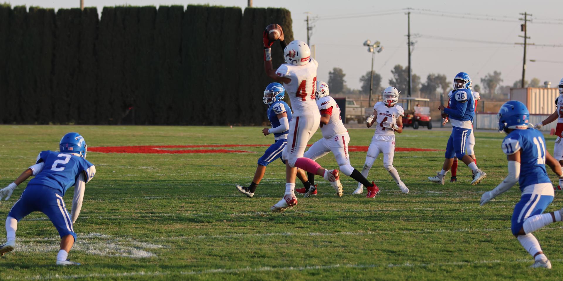 Junior Varsity football players in action against Caruthers