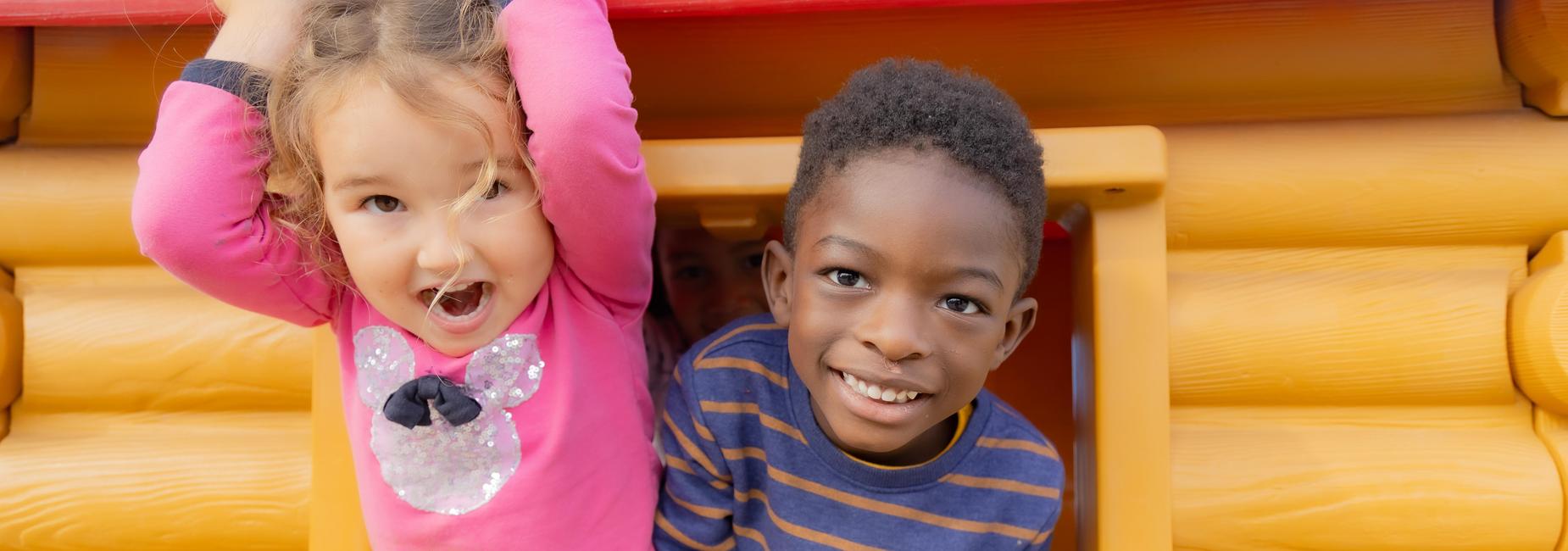 Two children in playhouse