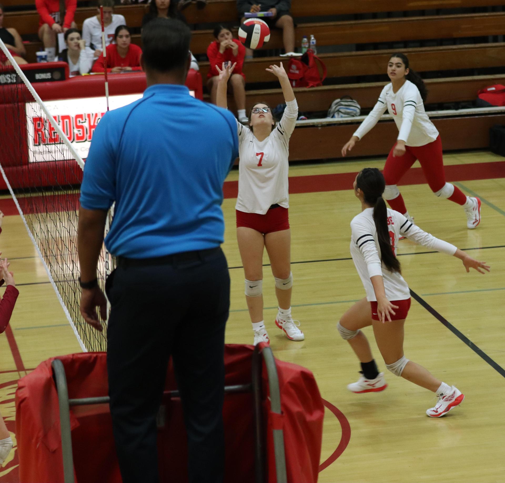 varsity volleyball players in action against golden valley