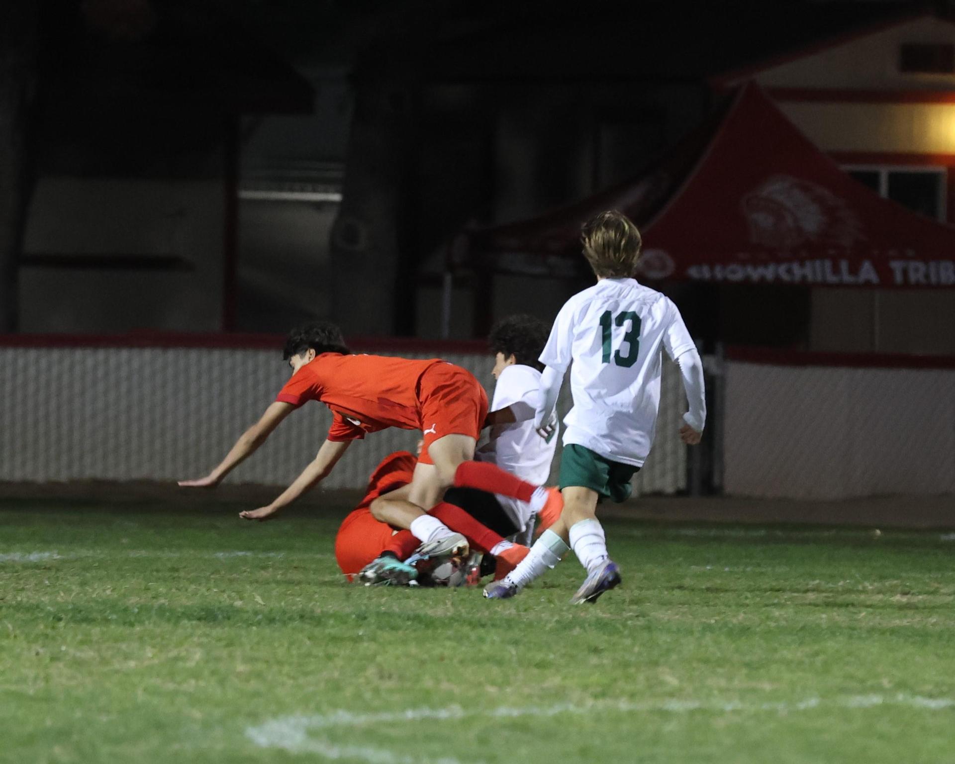 Varsity boys play soccer against Kingsburg