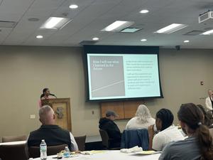 Zaniya presenting a powerpoint