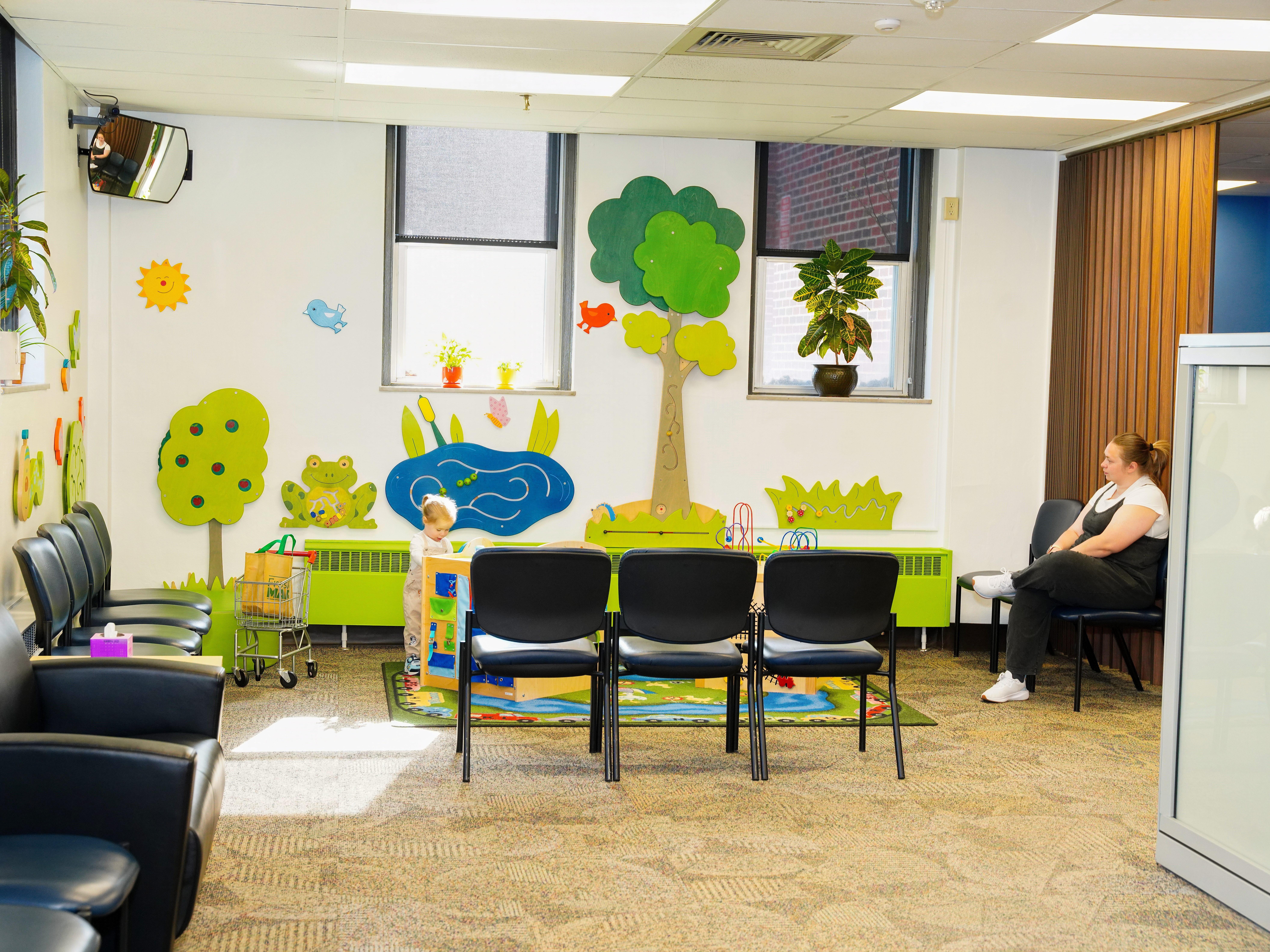 A mother and her child in the WIC waiting and play room.