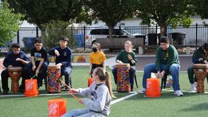 Ms. Scofield leading 7th graders to Cumbia beats
