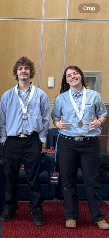 Smiling students with awards