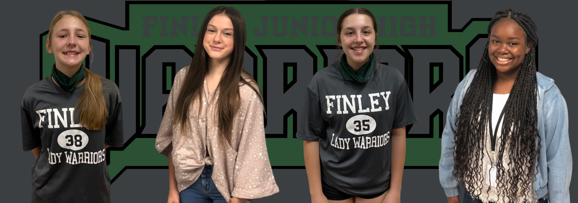 4 girls smiling 2 are in Finley jerseys in front of the Finley Warriors logo