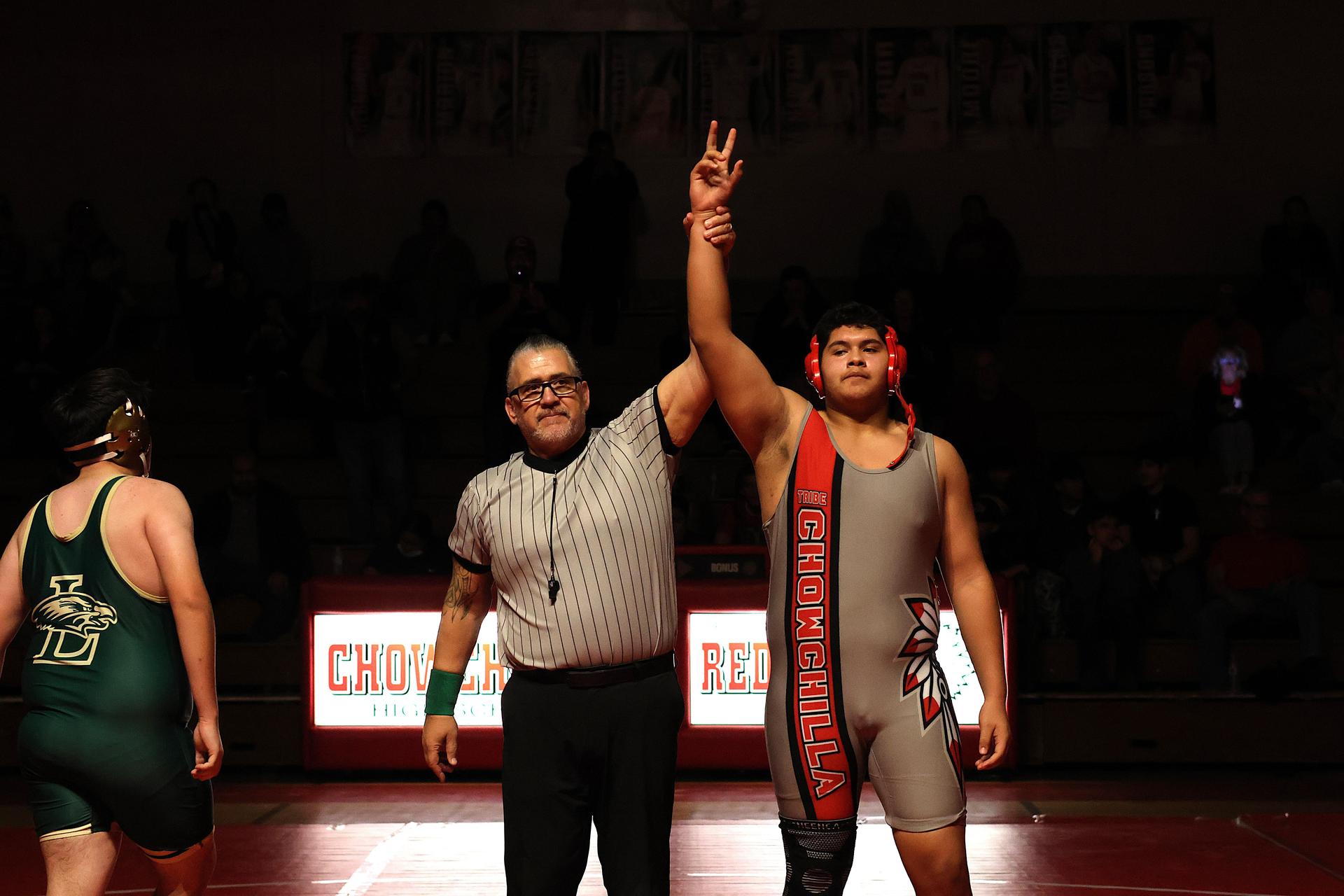Wrestling winners with hands up 134