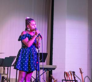 Lower schooler Singing during the talent show