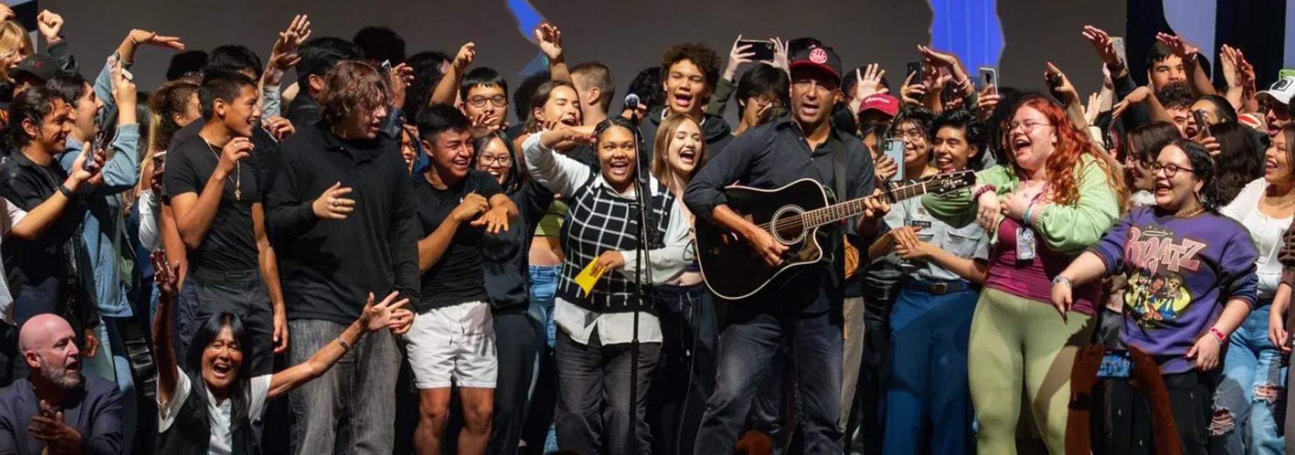 Tom Morello, from acclaimed rock band, Rage Against the Machine, rocks out on stage with VNHS students!