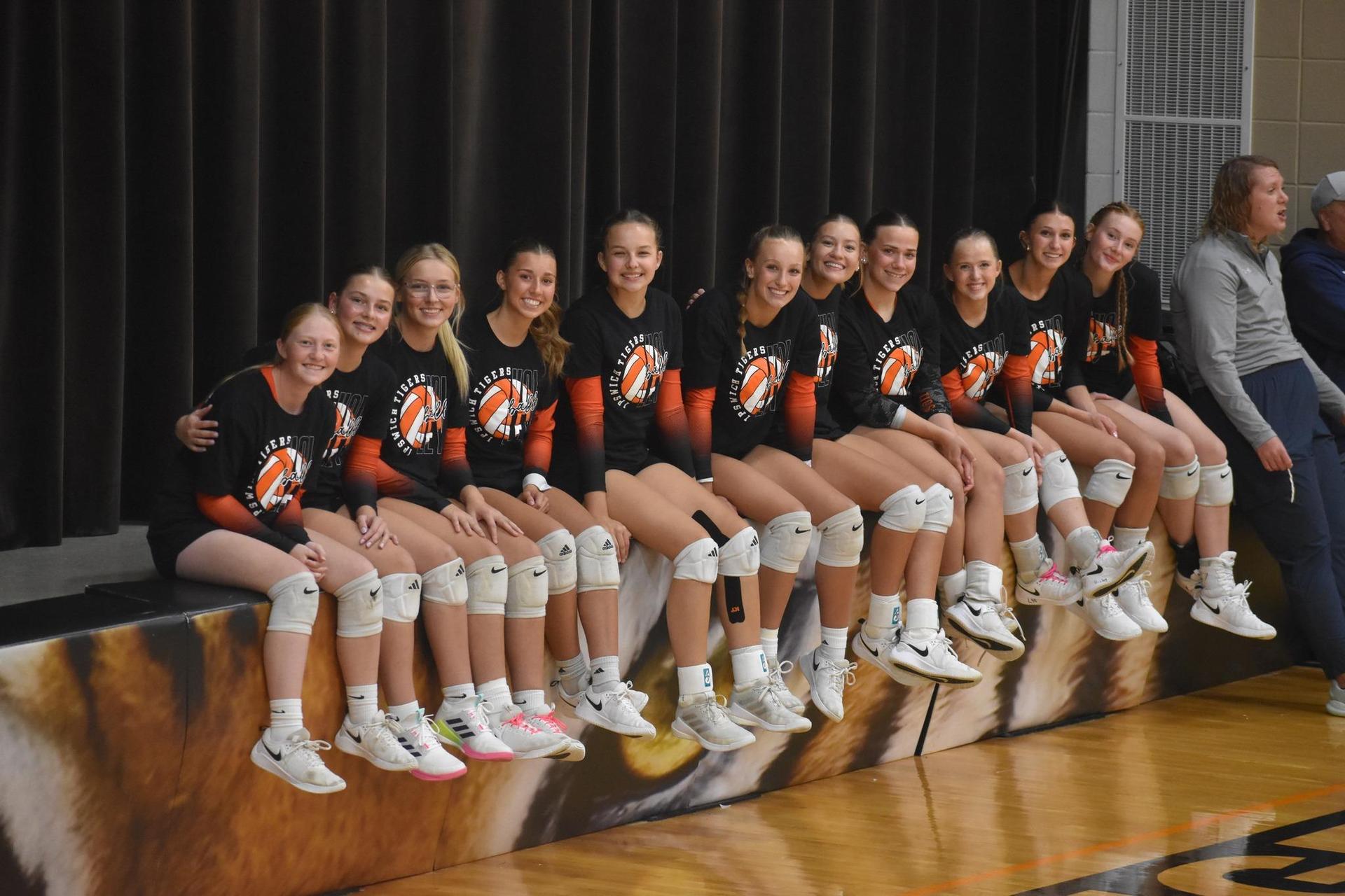 VB Girls sitting on the stage