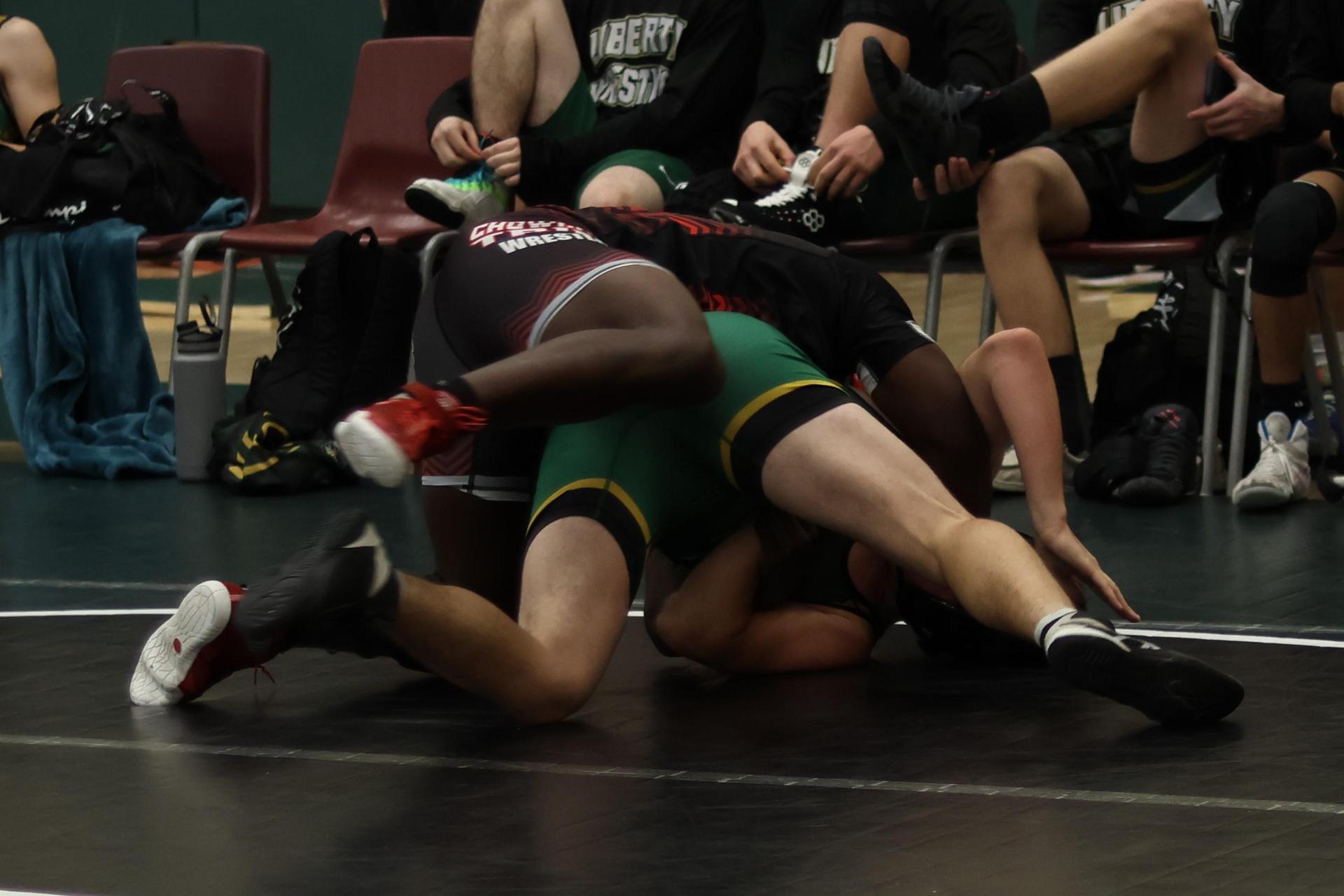 boys wrestling at liberty duals