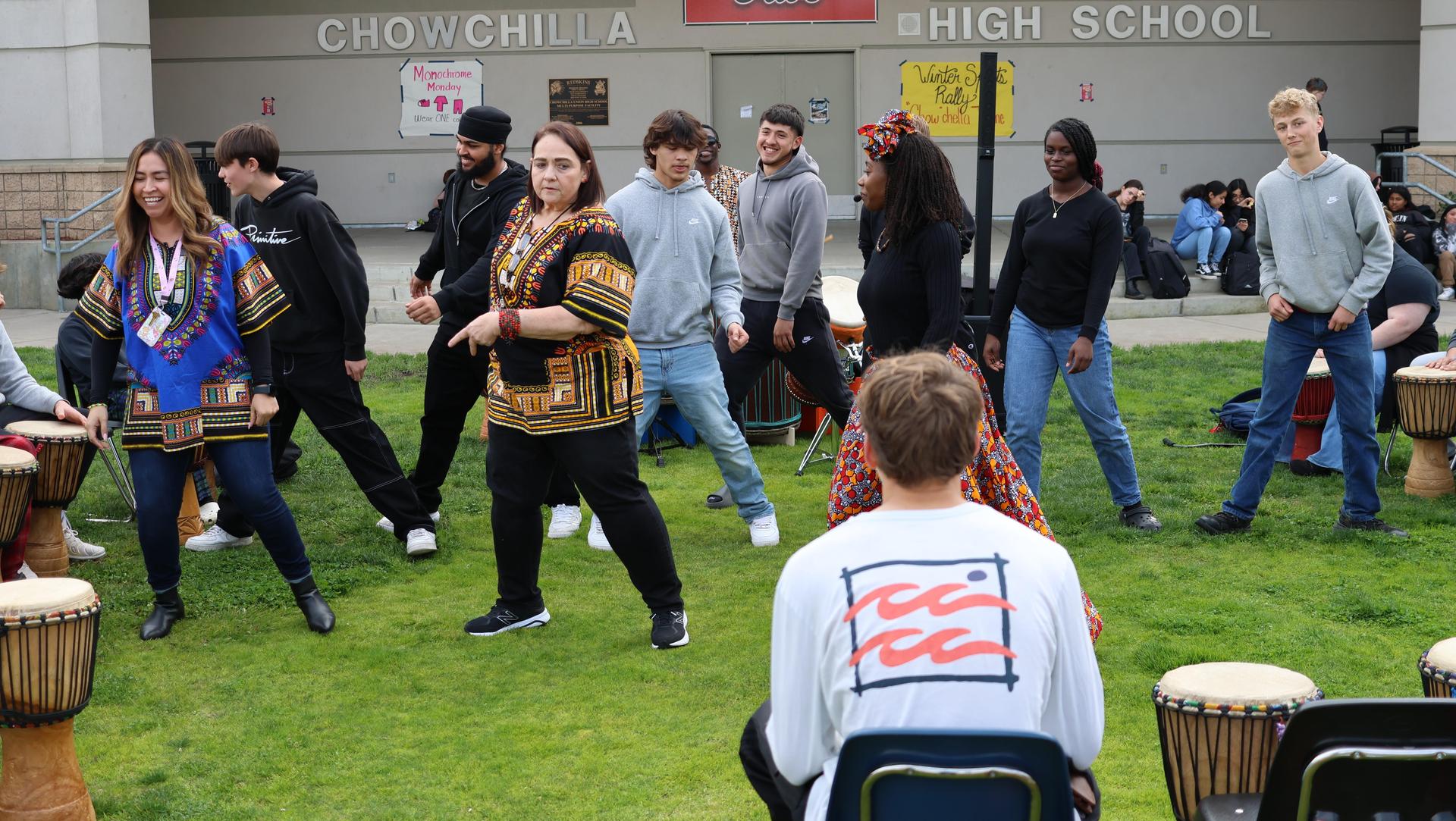 students and staff participating with the African Drum Interactive