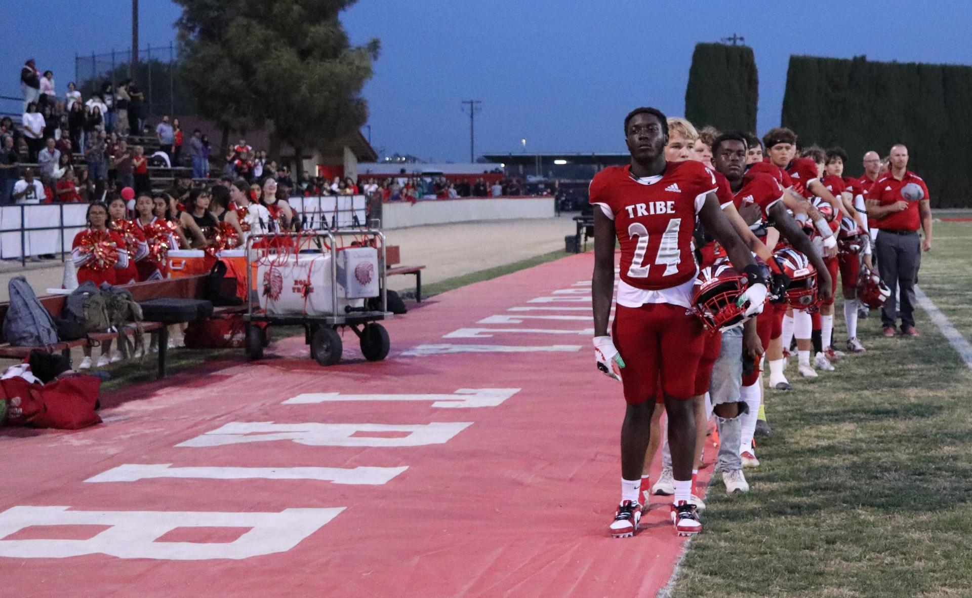 students, staff, and community members enjoying Friday night at the football game