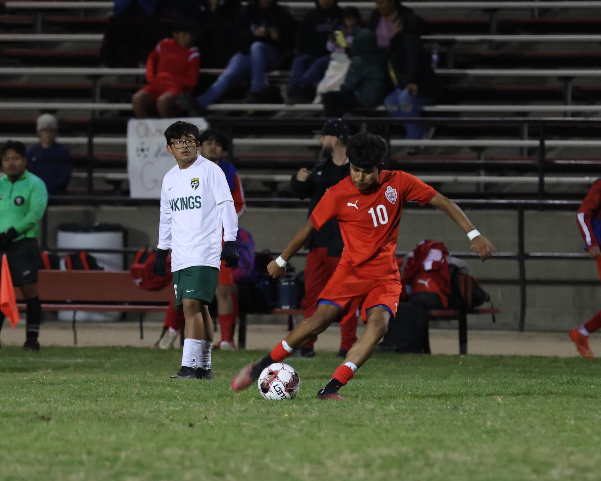 Varsity boys play soccer against Kingsburg