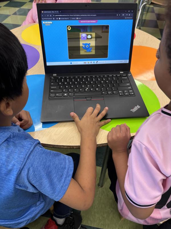 Students working together on Kodable