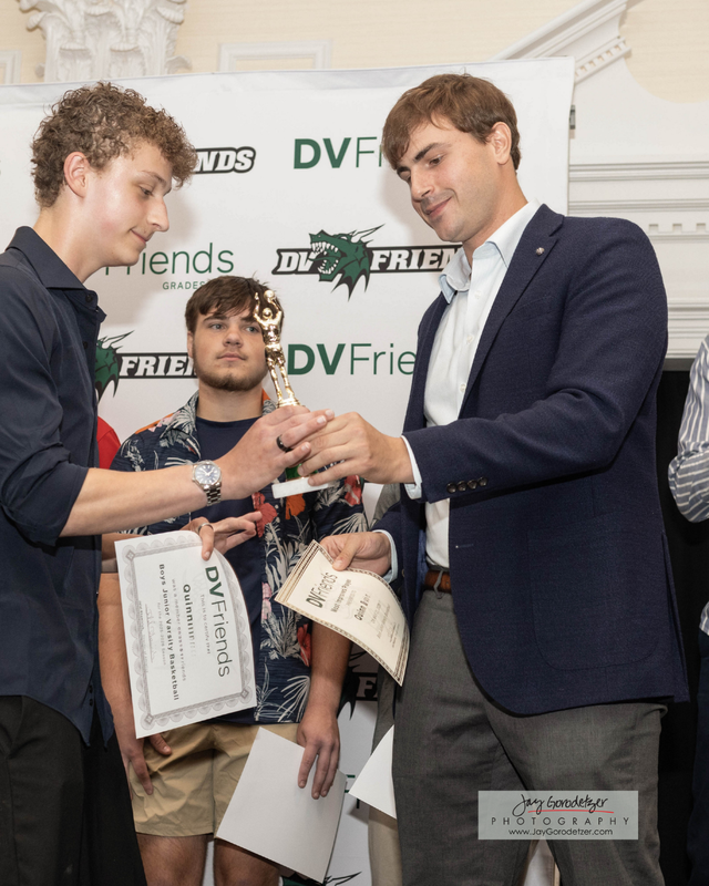Student Receiving award from Coach