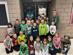 a group of students sitting in a school hallway