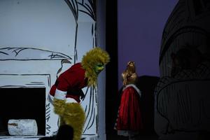 The Grinch and Cindy Lou Who perform onstage during Grinch the Musical