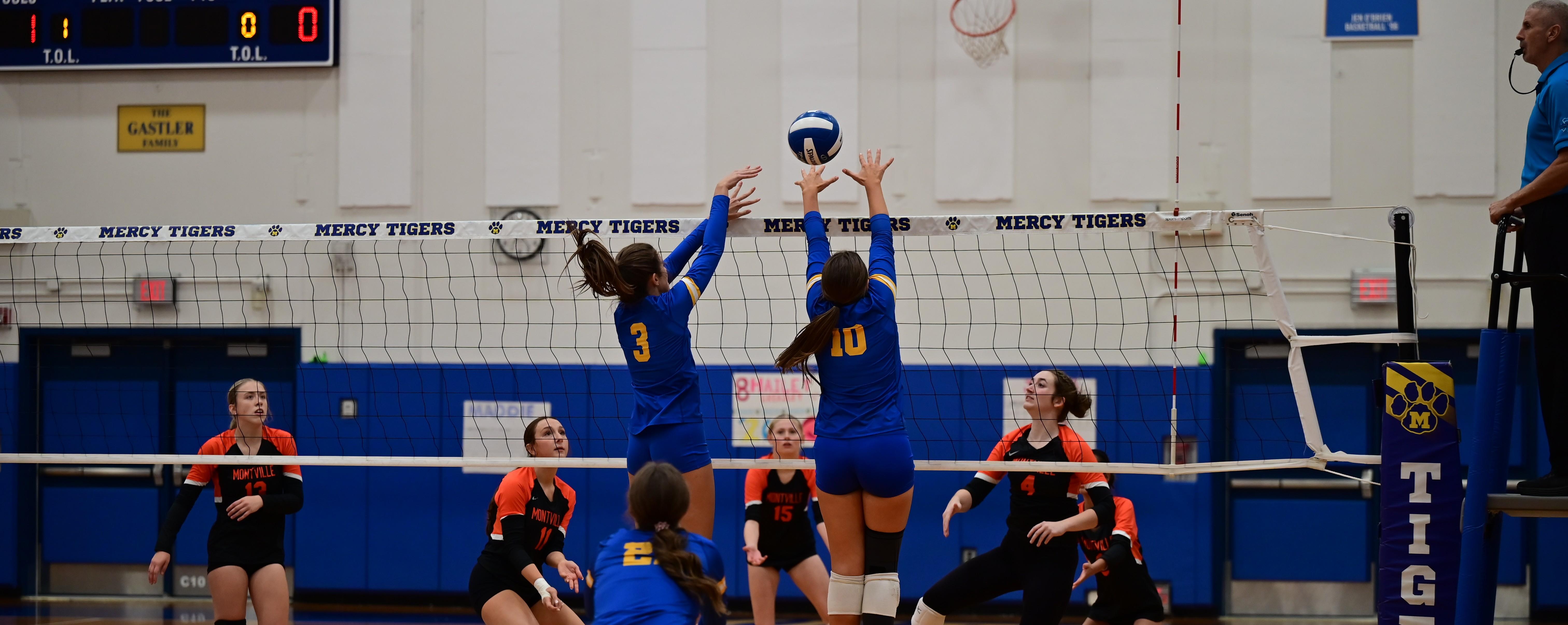 Mercy Volleyball players in action