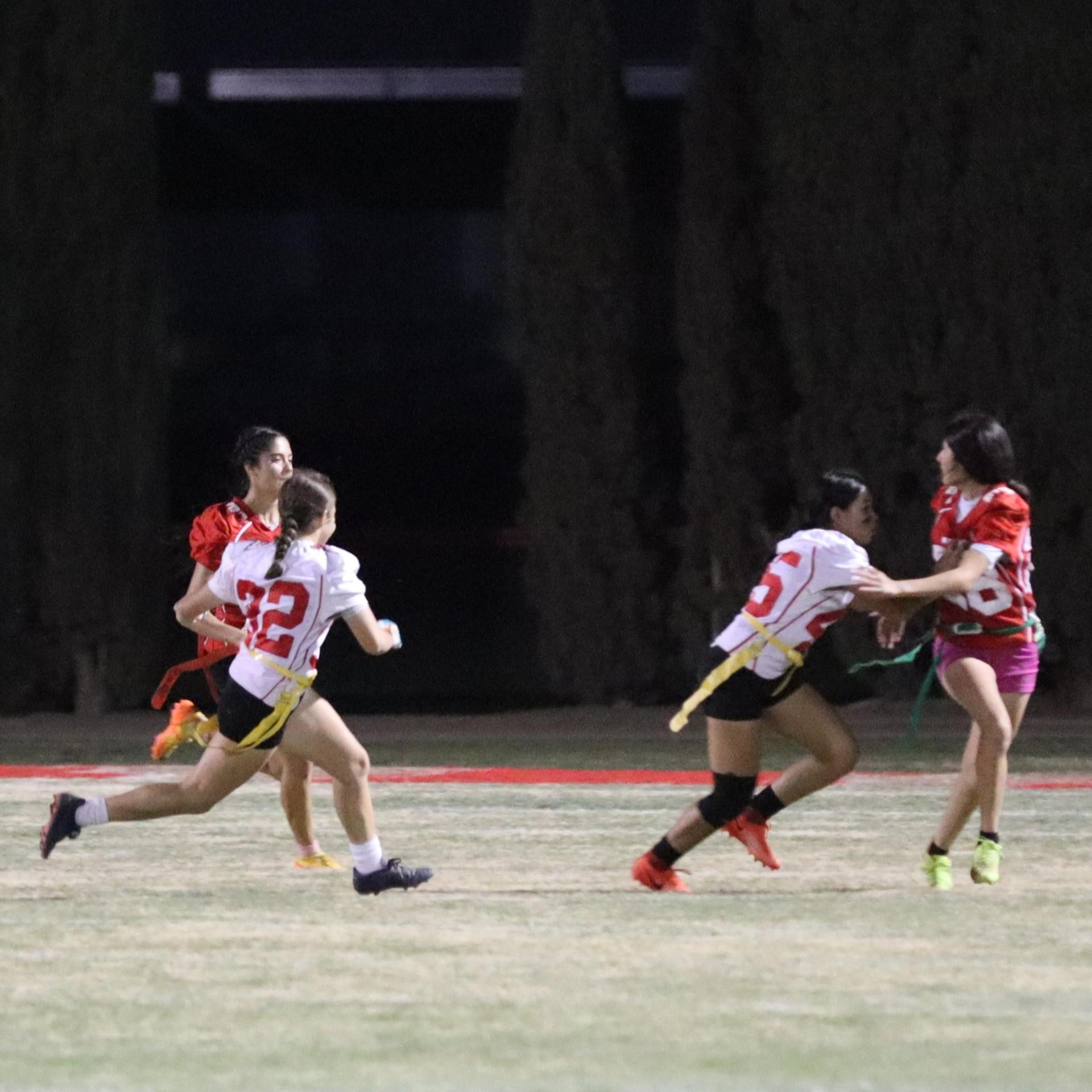 girls playing flag football