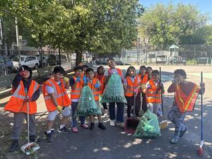 Students with their equipment cleaning up a community