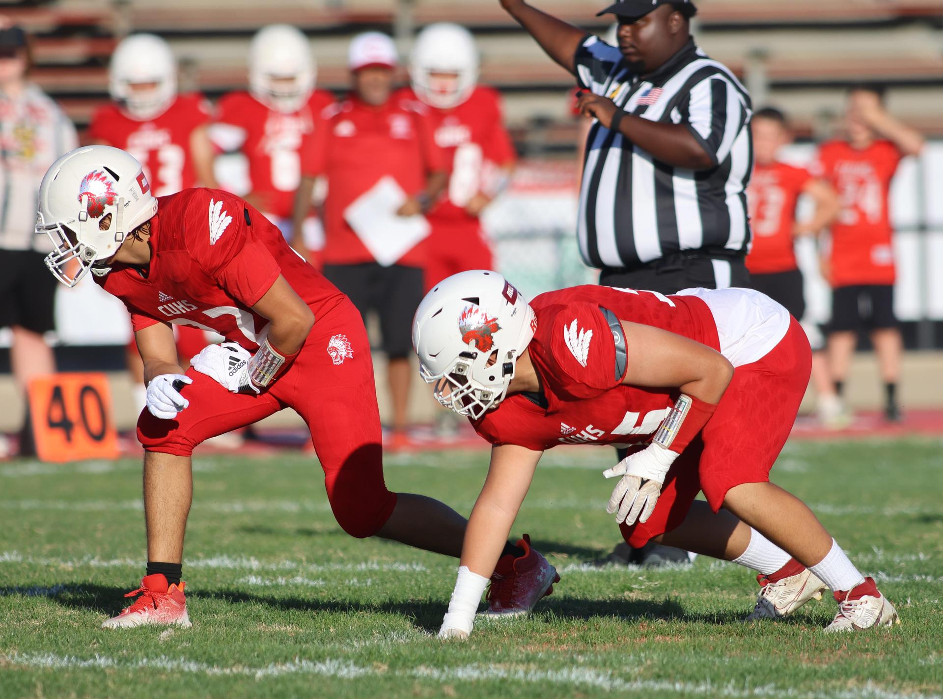junior varsity football players in action against Fowler