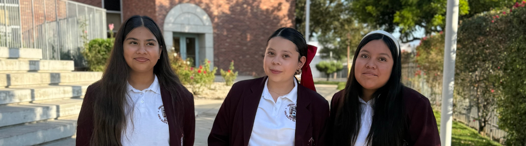 Three Ambassadors wait at the gate to greet guests