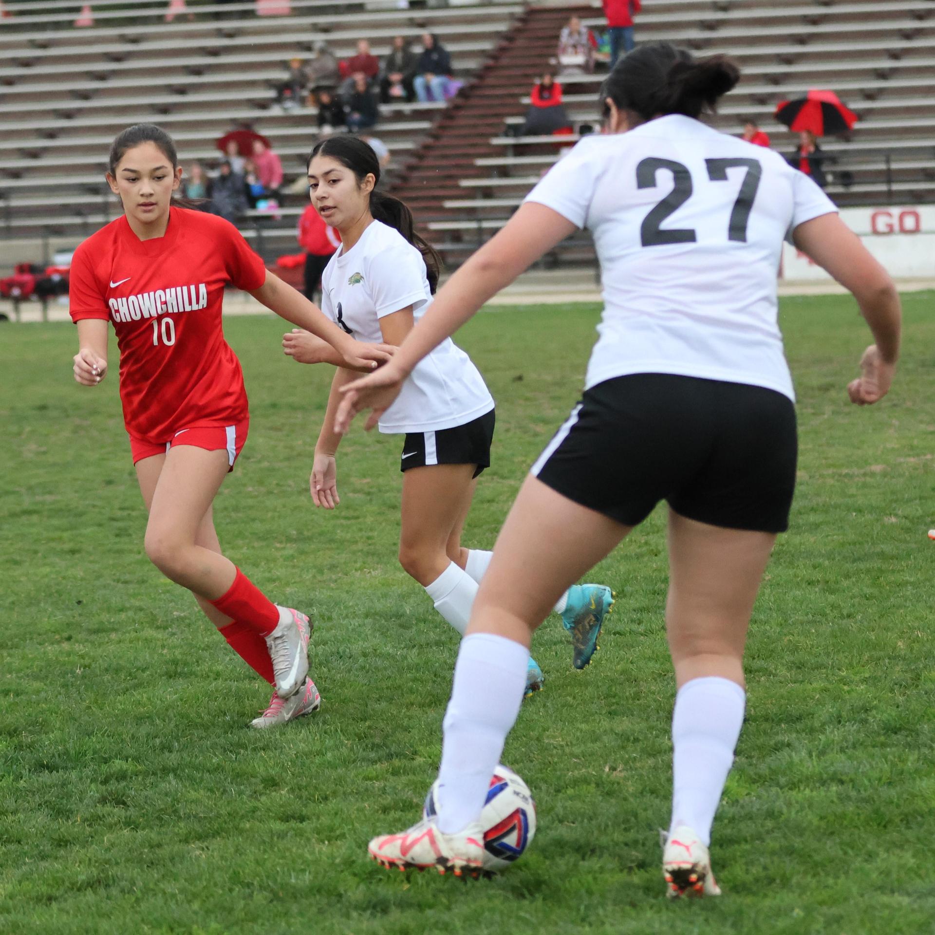 Junior varsity girls playing soccer against liberty