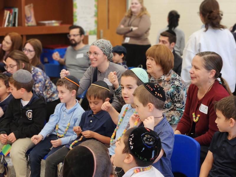 The students listen to the parsha